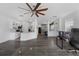Open concept living area with combined kitchen and living spaces, laminate flooring at 2330 Little Gem Loop, Sanford, FL 32773
