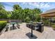 Community picnic area with green picnic tables, a BBQ grill, and well-maintained landscaping at 2330 Little Gem Loop, Sanford, FL 32773