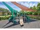 Community playground featuring colorful slides, climbing structures, and shaded areas for children at 2330 Little Gem Loop, Sanford, FL 32773