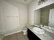 Neat bathroom featuring vanity with sink, toilet, and a large mirror at 235 Hibiscus St, Winter Haven, FL 33881