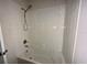 Clean and functional bathtub with tile surround and simple shower fixtures at 235 Hibiscus St, Winter Haven, FL 33881