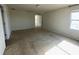 Spacious carpeted bedroom with natural light from a window at 235 Hibiscus St, Winter Haven, FL 33881