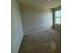 Bedroom with neutral carpet, paint, and one window at 235 Hibiscus St, Winter Haven, FL 33881