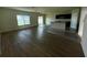 Open floorplan of the living room with island, wood floors, and lots of natural light at 235 Hibiscus St, Winter Haven, FL 33881
