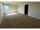 Spacious room with natural light, a window and carpet throughout the room at 235 Hibiscus St, Winter Haven, FL 33881