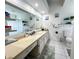 Well-lit bathroom with white vanity, decorative mirrors, and ample storage space, creating a serene atmosphere at 2376 Flamingo Lakes Dr, Kissimmee, FL 34743