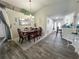 Elegant dining room with a formal dining table, chairs, a stylish chandelier, and tile flooring at 2376 Flamingo Lakes Dr, Kissimmee, FL 34743
