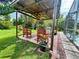 Outdoor grilling area with seating under covered patio with lighting at 2376 Flamingo Lakes Dr, Kissimmee, FL 34743