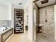 Bathroom features a shoe rack, walk-in shower with tiled walls, and modern fixtures at 2545 El Portal Ave, Sanford, FL 32773