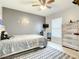Neutral bedroom with moon decor, light wood floors, and modern white accents at 2545 El Portal Ave, Sanford, FL 32773