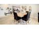 Bright dining area showcases elegant furnishings and seamless transition into the modern, fully equipped kitchen at 2545 El Portal Ave, Sanford, FL 32773