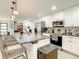 Modern kitchen with granite island, seating, stainless steel appliances, and an open layout, ideal for entertaining guests at 2545 El Portal Ave, Sanford, FL 32773