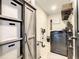 Well-organized laundry room featuring built-in storage and modern appliances at 2545 El Portal Ave, Sanford, FL 32773
