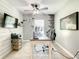 Bright office space with custom wall trim, ceiling fan, desk and light gray walls at 2545 El Portal Ave, Sanford, FL 32773
