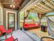 Relaxing covered patio area with comfortable seating, perfect for enjoying outdoor living at 2545 El Portal Ave, Sanford, FL 32773