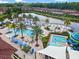 Resort-style community pools, waterslide, and lush landscaping create a tropical paradise at 2706 Camaro Dr, Kissimmee, FL 34746