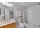 This bathroom featuring a combination tub and shower with decorative shower curtain at 2706 Camaro Dr, Kissimmee, FL 34746
