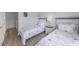 Bright bedroom featuring two twin beds with sea star bedding and wood floors at 2706 Camaro Dr, Kissimmee, FL 34746