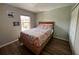 Neutral bedroom featuring a wood frame bed and closet at 2706 Camaro Dr, Kissimmee, FL 34746