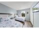 Bright bedroom featuring two twin beds with sea star bedding and wood floors at 2706 Camaro Dr, Kissimmee, FL 34746