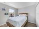 This bedroom features a double bed and is illuminated by natural light from a nearby window at 2706 Camaro Dr, Kissimmee, FL 34746