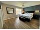 Spacious bedroom boasts a large window and king bed with colorful bedding at 2706 Camaro Dr, Kissimmee, FL 34746