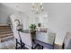 Dining room featuring a modern chandelier and table with upholstered chairs, perfect for Gathering meals at 2706 Camaro Dr, Kissimmee, FL 34746