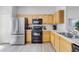 Well-equipped kitchen featuring stainless steel refrigerator and a black oven at 2706 Camaro Dr, Kissimmee, FL 34746