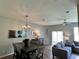 Open concept living space with dining area, comfortable seating, and modern decorations at 2706 Camaro Dr, Kissimmee, FL 34746