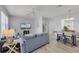 Comfortable living room and dining area with hardwood floors and modern furniture at 2706 Camaro Dr, Kissimmee, FL 34746