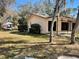 Rear view of home with large, covered patio and spacious yard at 285 W 2Nd St, Chuluota, FL 32766