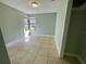 Light-filled bedroom with tile flooring and a bright window at 285 W 2Nd St, Chuluota, FL 32766