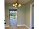 Entryway with tile flooring and a view of the backyard through a glass sliding door at 285 W 2Nd St, Chuluota, FL 32766