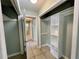 Hallway with tile flooring and an open closet at 285 W 2Nd St, Chuluota, FL 32766
