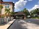 View of the Galleria Palms Hotel's entrance and driveway, showing a welcoming arrival area at 3000 Maingate Ln # 210, Kissimmee, FL 34747