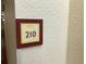 Picture of a room number 210 on the wall at 3000 Maingate Ln # 210, Kissimmee, FL 34747