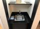 Compact vanity with sink, offering a functional and clean space for personal care in the hotel room at 3000 Maingate Ln # 210, Kissimmee, FL 34747
