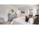 This bedroom features a stylish dresser with mirror and neutral decor at 3061 Moulin Rd, Davenport, FL 33837
