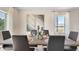 Elegant dining room with contemporary art, modern decor, and neutral tones at 3061 Moulin Rd, Davenport, FL 33837