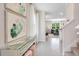 Bright entryway featuring neutral walls, gray tile flooring and views of the living room, with stylish accents at 3061 Moulin Rd, Davenport, FL 33837