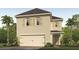 Two-story home with a two-car garage, neutral stucco facade, complemented by tan shutters and well-maintained landscaping at 3061 Moulin Rd, Davenport, FL 33837