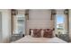 Cozy bedroom featuring a large bed with decorative pillows and bedside tables with lamps at 3061 Moulin Rd, Davenport, FL 33837