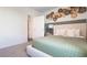 Cozy bedroom featuring a decorative wall and a comfortable bed with green accents at 3065 Moulin Rd, Davenport, FL 33837