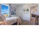 Inviting bedroom featuring a comfortable bed, bright window, and stylish decor at 3065 Moulin Rd, Davenport, FL 33837