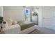 Neutral bedroom design with carpet, large window and comfortable bed with decorative pillows at 3065 Moulin Rd, Davenport, FL 33837