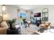 Comfortable living room with contemporary decor, neutral colors, and a sliding glass door to the outside at 3065 Moulin Rd, Davenport, FL 33837