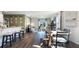 Bright, open-concept living and dining area with stylish decor and a sliding glass door to the backyard at 3065 Moulin Rd, Davenport, FL 33837