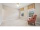 Cozy bedroom with natural light, neutral walls, and patterned curtains at 3201 Glenmere Way, Orlando, FL 32828