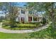 Two story home with blue shutters and lush landscaping at 3201 Glenmere Way, Orlando, FL 32828