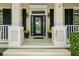 Inviting front entry featuring decorative glass door, sidelights, and potted plants at 3201 Glenmere Way, Orlando, FL 32828